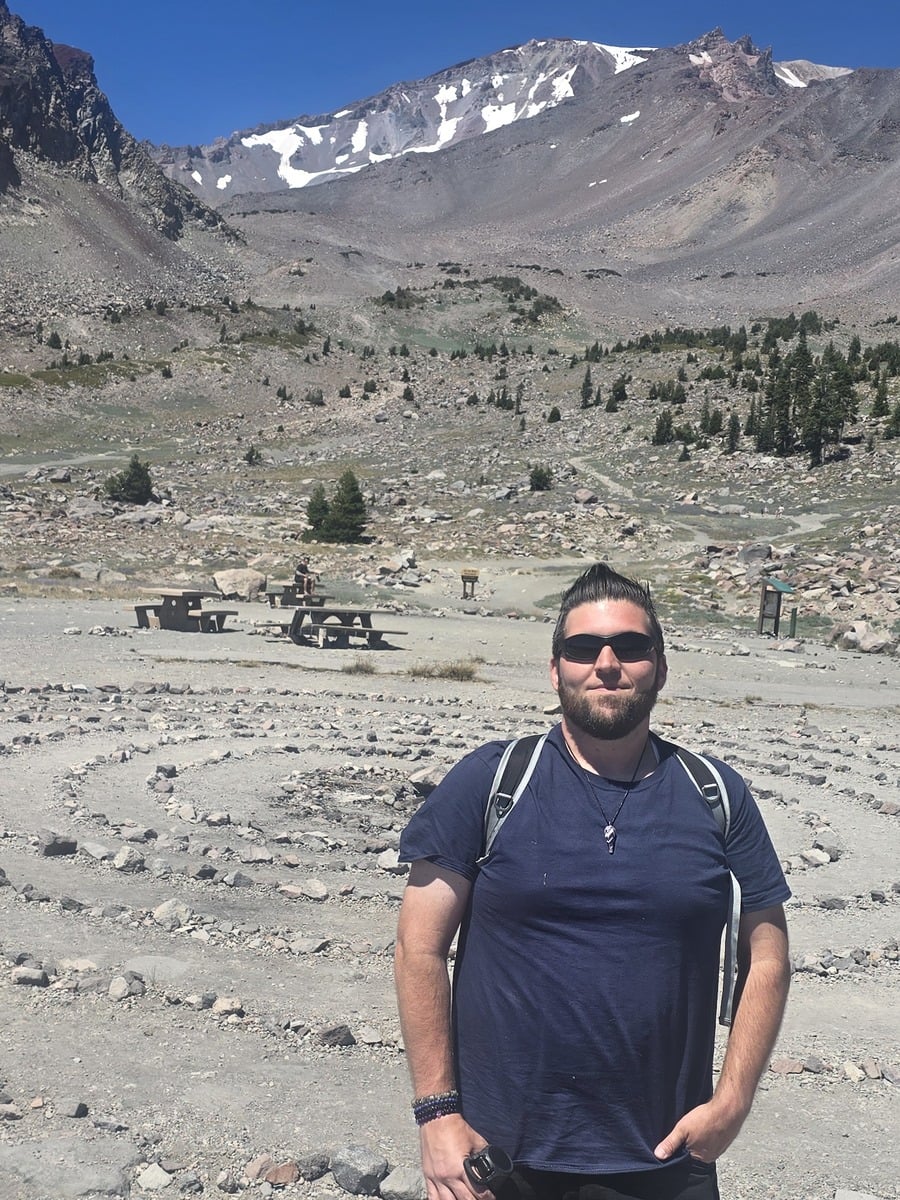 Will standing in a mountain landscape